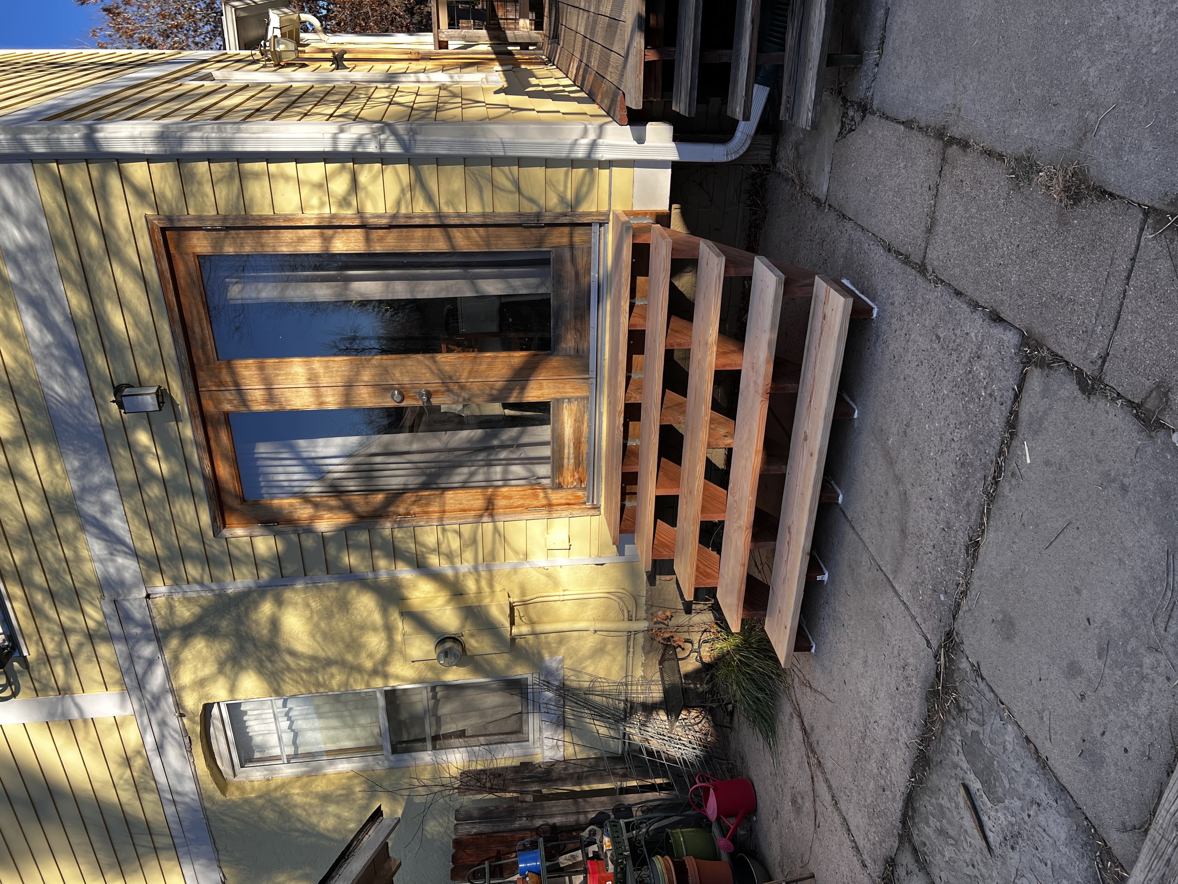 Custom wood deck construction by Flora Landscaping
